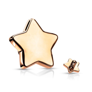 Joya microdermal en forma de estrella en varios colores.
