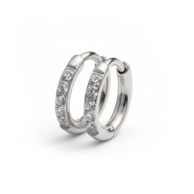 Par de aros huggie de titanio con pedrería