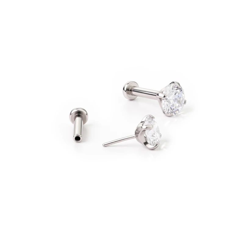 Labret push-in en titanio con brillante en engaste de garras