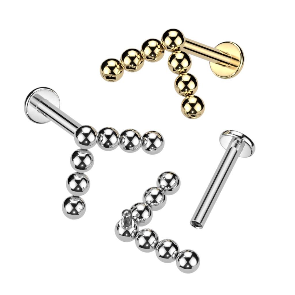 Labret de titanio con diseño de bolitas en flecha