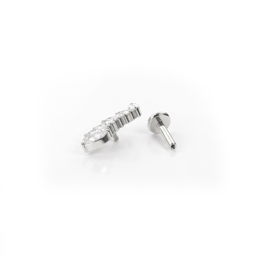 Labret de titanio con piedras redondas y de corte marquise