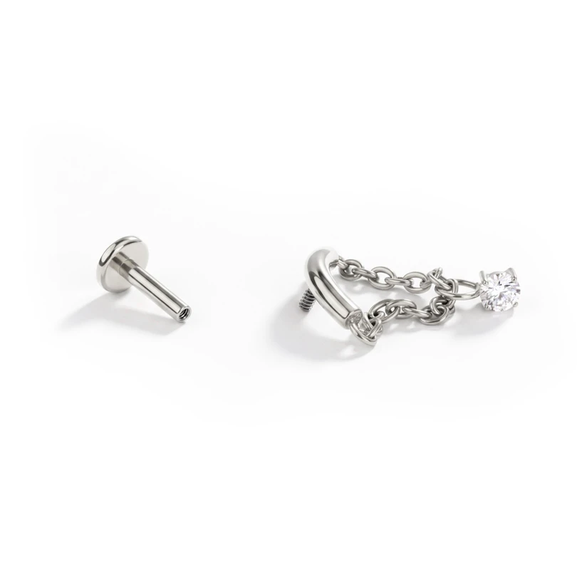 Labret con barra curvada y cadena con piedra colgante