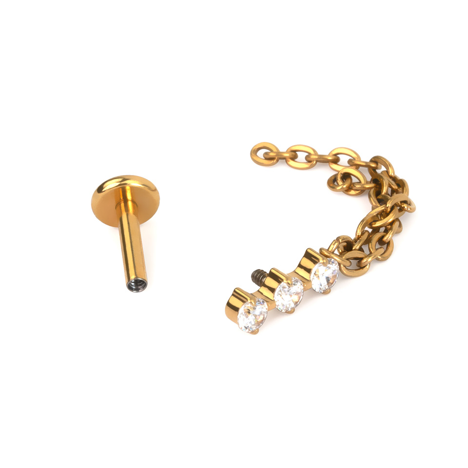 Labret de titanio con trío de piedras y cadena doble colgante