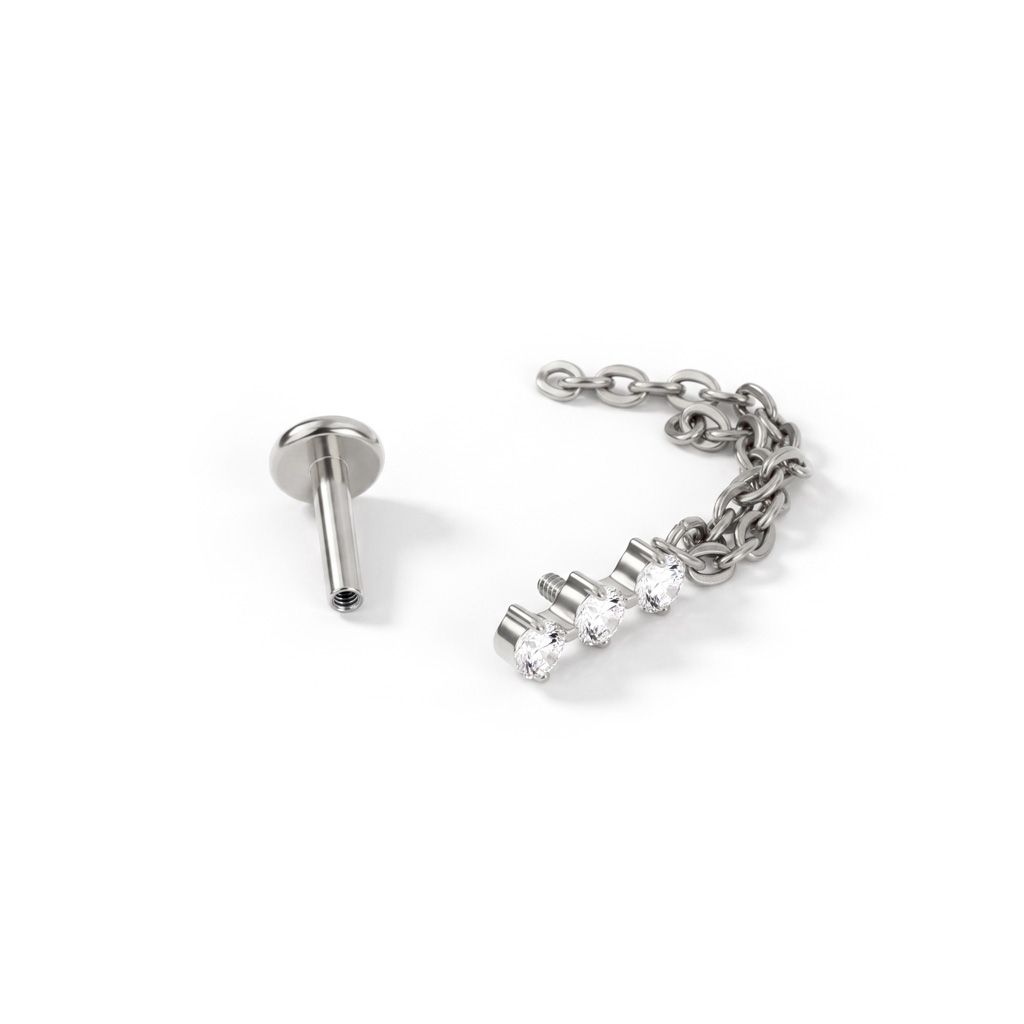 Labret de titanio con trío de piedras y cadena doble colgante