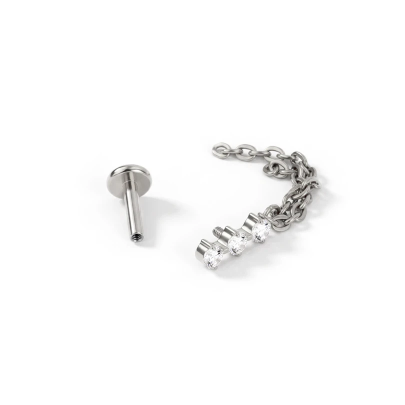 Labret de titanio con trío de piedras y cadena doble colgante