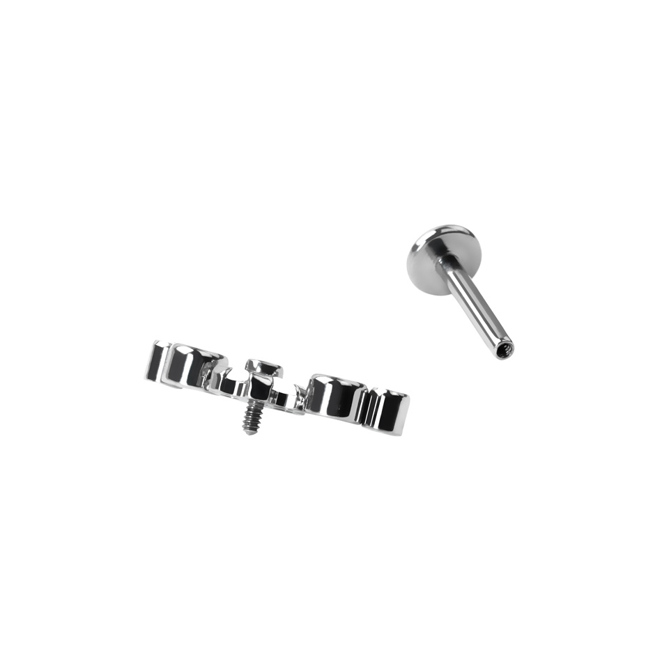 Labret de titanio con flor central y piedras circonitas