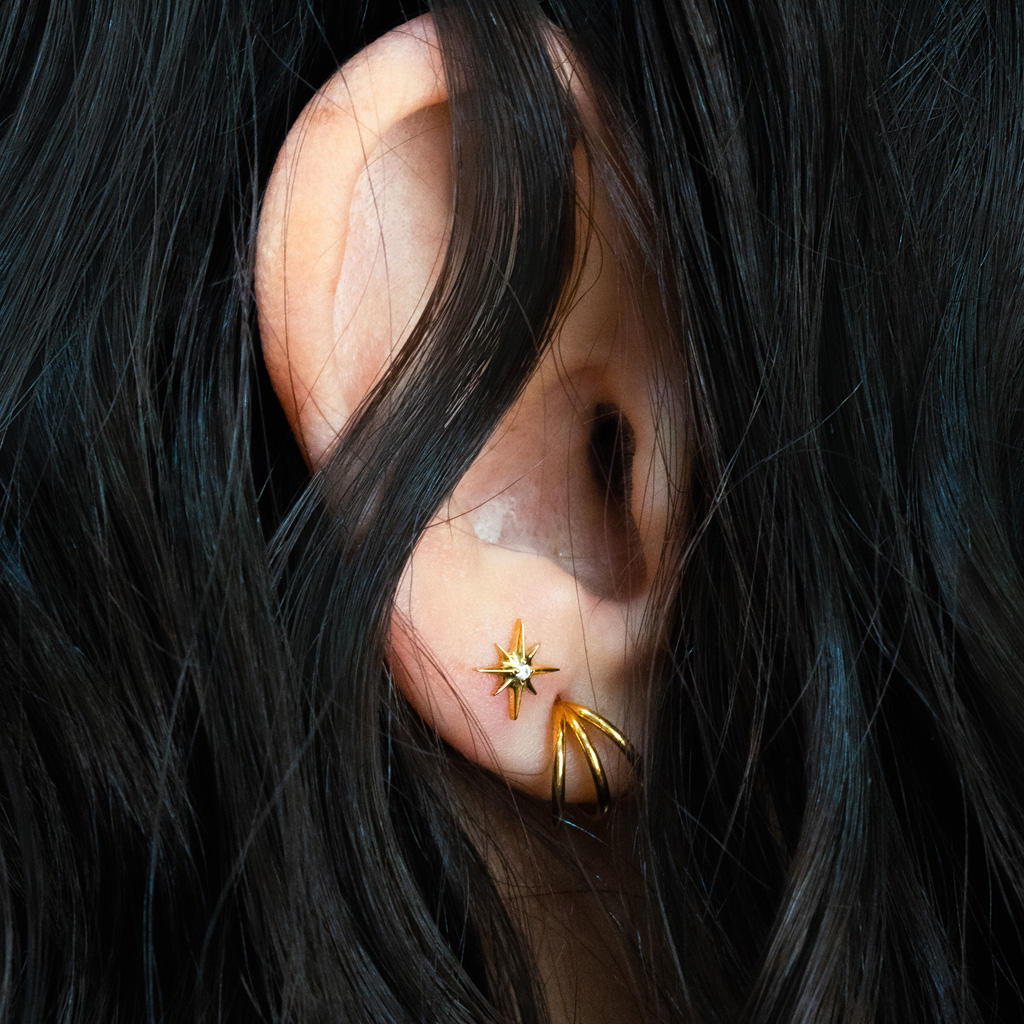 Labret de titanio en forma de estrella con piedra central