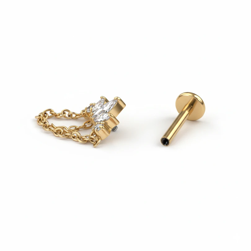 Labret de titanio con pedrería y cadenas