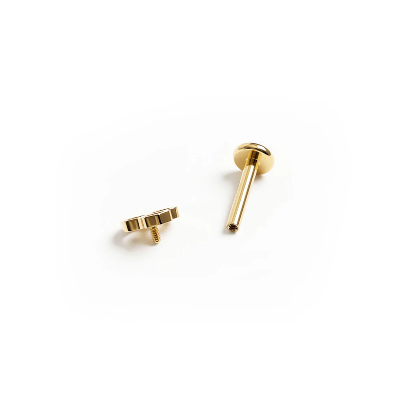 Labret de titanio con diseño de panal