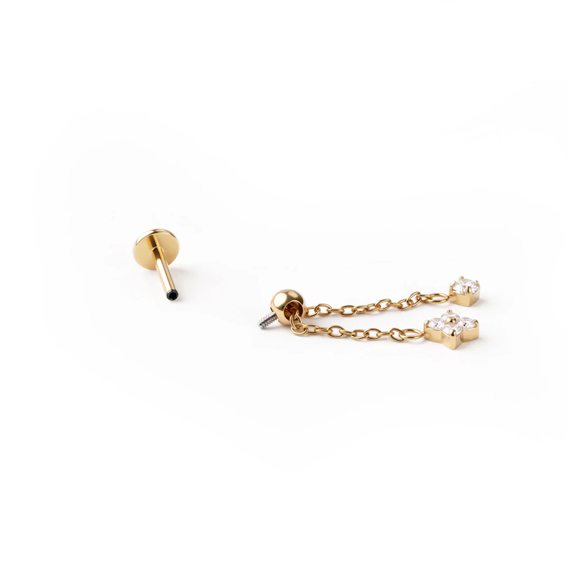 Labret de titanio con cadena móvil y florecilla