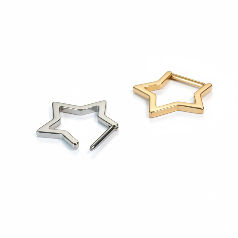 Aro clicker de titanio en forma de estrella