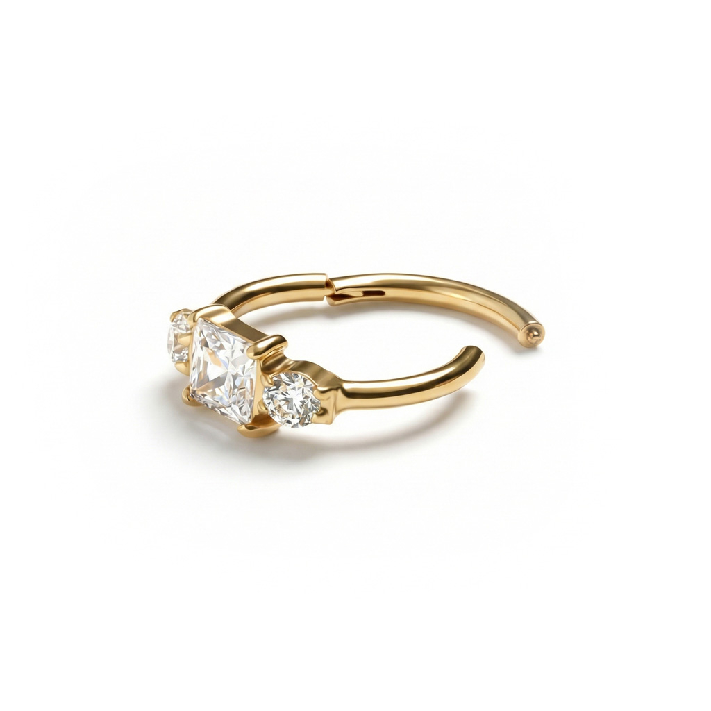 Aro de titanio con bisagra y tres piedras de circonita